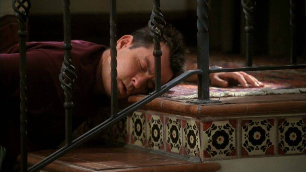 Charlie Harper from Two and a Half Men on the floor drunk