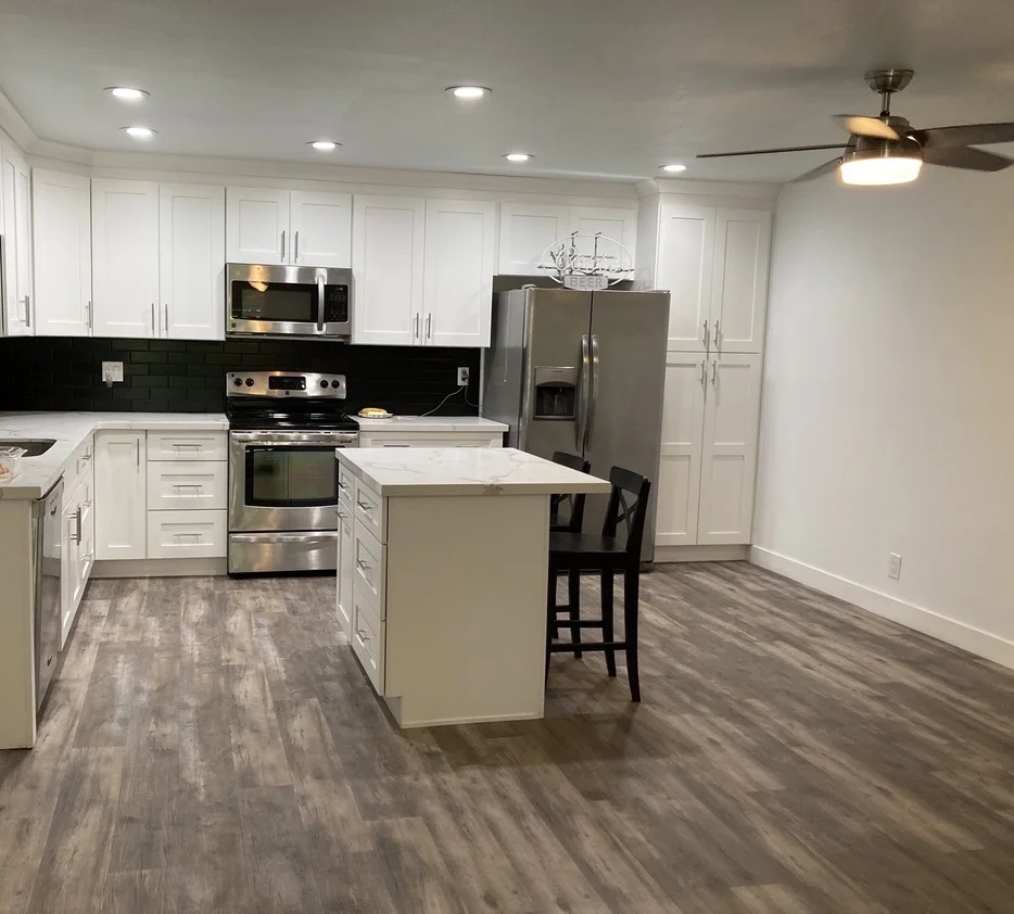 Trendy black and white condo kitchen